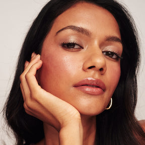 Woman wearing The No-Makeup Makeup Kit and Eye Perfecting Shimmer Stick in Pearl for a radiant, natural glow.