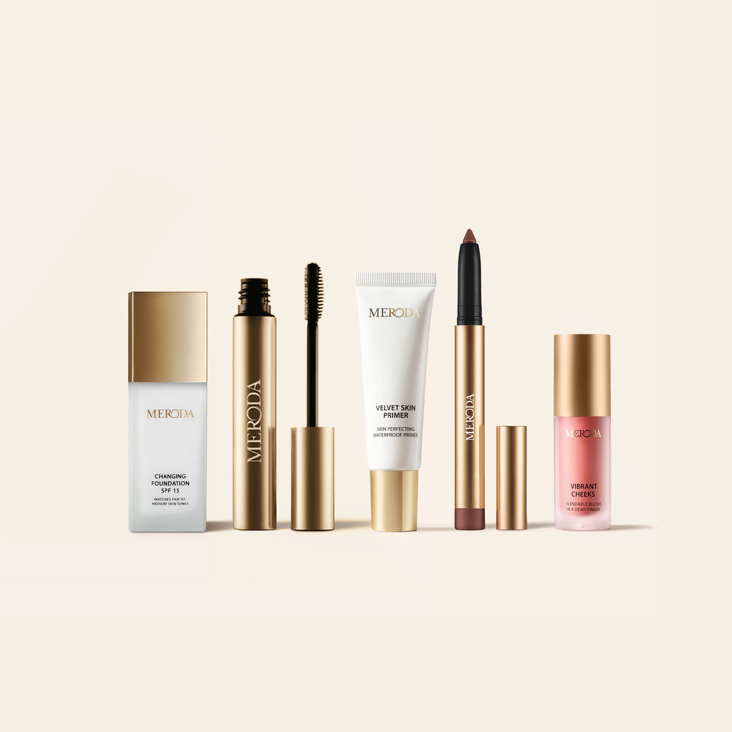 Meroda Cosmetics The Full Face Bestseller Set featuring Changing Foundation, Precision Brow Gel, Velvet Skin Primer, Eye Perfecting Shimmer Stick and Vibrant Cheeks Liquid Blush on a light background
