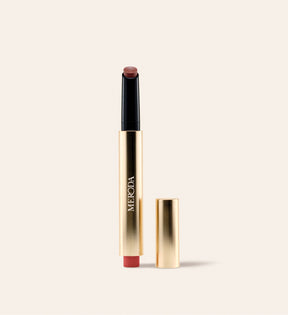 Hydrating Lip Tint packshot in shade Rich Berries showing the open golden tube