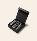 Gift Box noir mat à fermeture magnétique contenant des produits Meroda Cosmetics et un pinceau de maquillage doré.