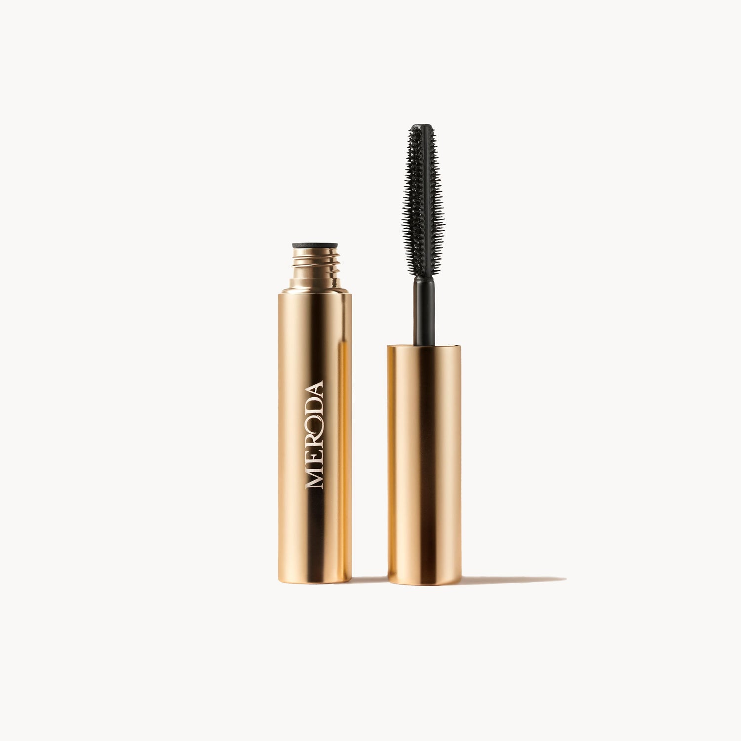 Gilded Lashes Mascara Sample 2 ml open gold tube and wand applicator for length and volume