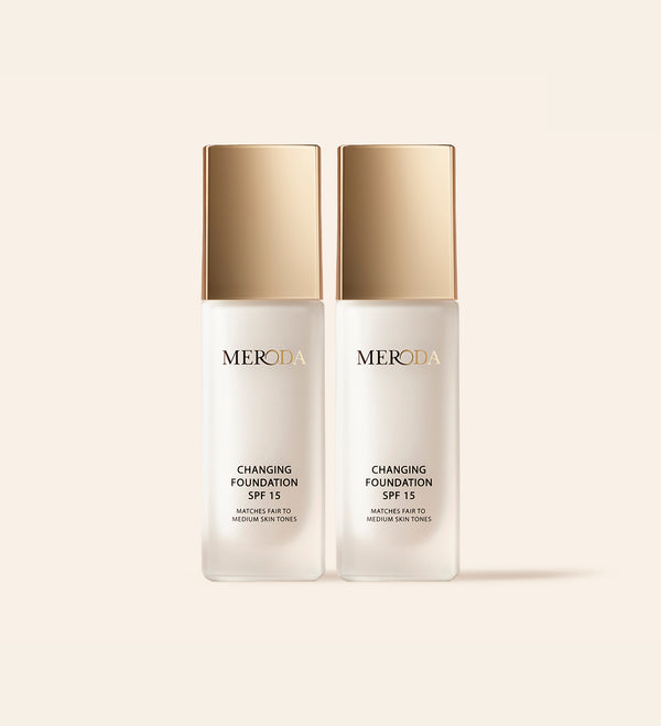 Two Meroda Changing Foundation SPF 15 bottles with gold caps from the 2 Bottles (+ Gifts) bundle.