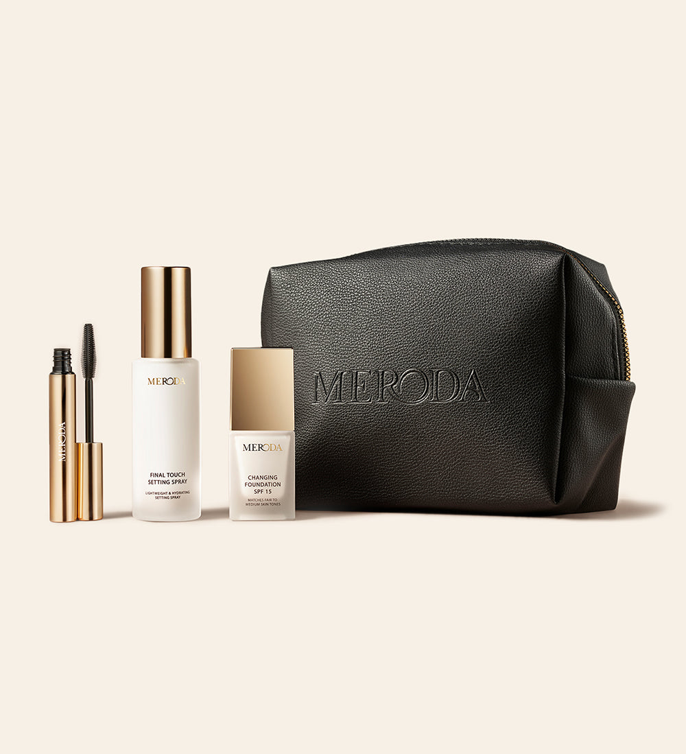 Meroda Cosmetics Travel Kit featuring mini Changing Foundation, Final Touch Setting Spray, Gilded Lashes Mascara and a black travel bag