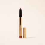 Meroda Cosmetics Eye Perfecting Shimmer Stick in Bronze displayed open in a gold case on a light background.