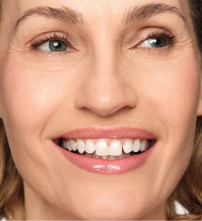 Hydrating Lip Tint application on model in shade Dusty Rose showing a sheer satin color