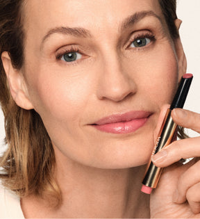 Hydrating Lip Tint application on model in shade Dusty Rose showing hydrated and naturally tinted lips