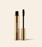 Meroda Cosmetics The Precision Brow Gel in an open gold tube with a silicone applicator brush on a light background