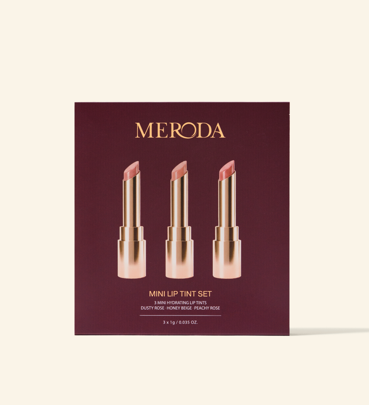 Mini Lip Tint Trio box featuring three hydrating lip tints in Dusty Rose, Honey Beige, and Peachy Rose.